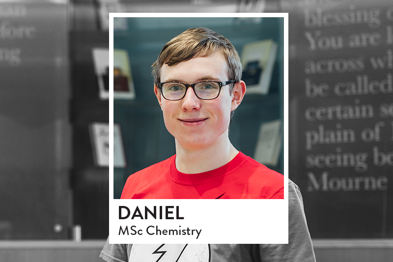 Image of student in CS Lewis Reading Room with red t-shirt