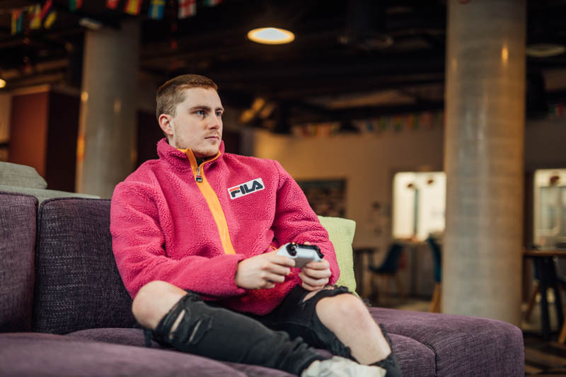 Image of Ross in Elms BT1 playing video games