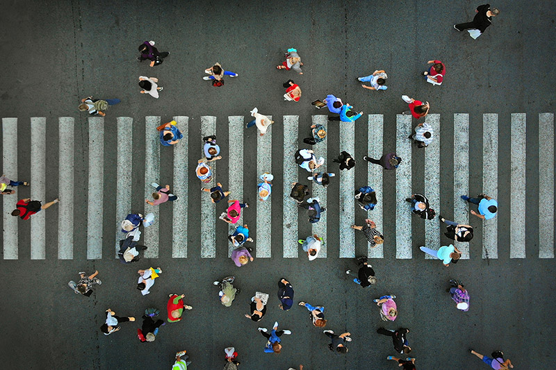 People walking across the street