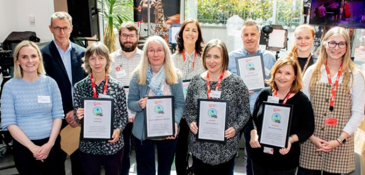 Lab representatives holding their Bronze Award Certificates