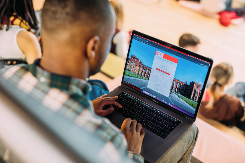 Student using careers service on laptop