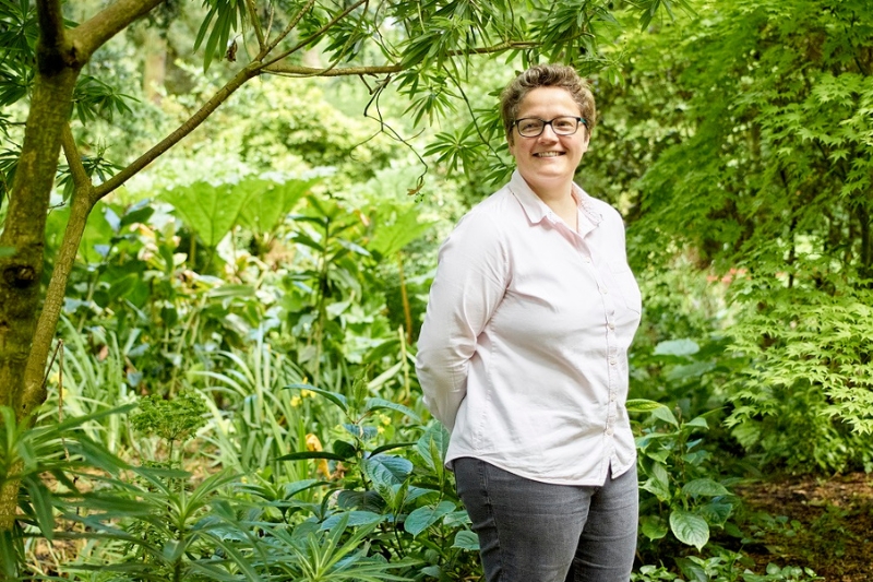 Professor Ruth Hunter surrounded by vegetation