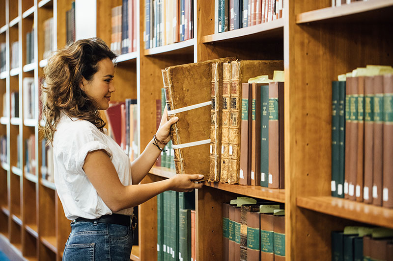 Female student in special collections
